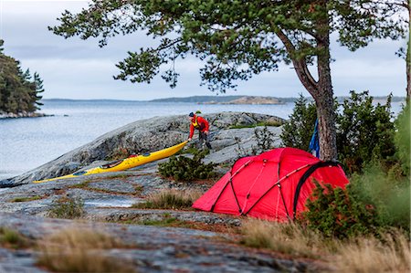 Person camping at sea Stock Photo - Premium Royalty-Free, Code: 6102-08480972
