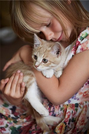 smiling animal - Girl with cat Stock Photo - Premium Royalty-Free, Code: 6102-08481058