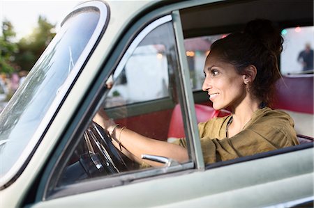driving vintage car - Smiling woman driving Stock Photo - Premium Royalty-Free, Code: 6102-08481144