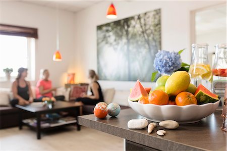 room mates - Bowl with fruits, women on background Stock Photo - Premium Royalty-Free, Code: 6102-08481154
