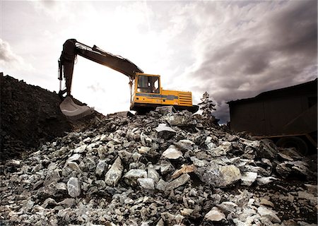 Excavator on construction site Stock Photo - Premium Royalty-Free, Code: 6102-08558777