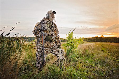 simsearch:6102-06337050,k - Man hunting with rifle Stock Photo - Premium Royalty-Free, Code: 6102-08558870