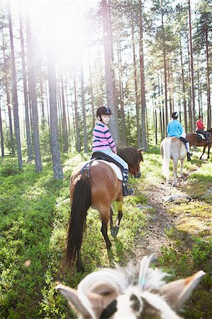 simsearch:6102-08542382,k - Horseback riding through forest Stock Photo - Premium Royalty-Free, Code: 6102-08559135