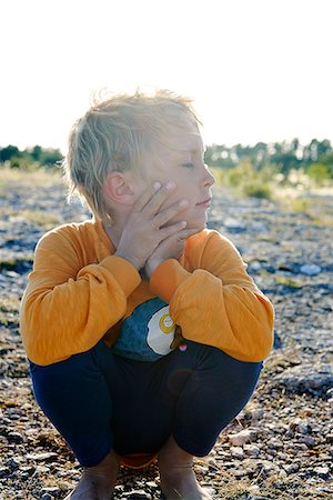 simsearch:6102-08000621,k - Boy with eyes closed, Gotland, Sweden Stock Photo - Premium Royalty-Free, Code: 6102-08559327