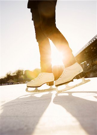 simsearch:6102-06337107,k - Sweden, Stockholm, close-up view of backlit girl (6-7) legs ice skating Photographie de stock - Premium Libres de Droits, Code: 6102-08566084