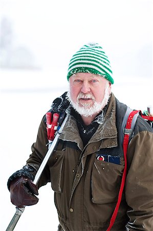 simsearch:6102-08520961,k - Man holding ski pole in winter Stock Photo - Premium Royalty-Free, Code: 6102-08566188