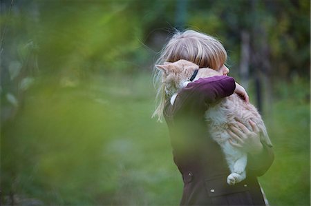 Girl with cat Stock Photo - Premium Royalty-Free, Code: 6102-08566564