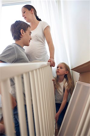 simsearch:6102-08566788,k - Mother and children building cot Stock Photo - Premium Royalty-Free, Code: 6102-08566785