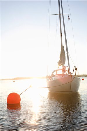 sailboats water nobody - Sailing boat against the sunset, Sweden. Stock Photo - Premium Royalty-Free, Code: 6102-08566999