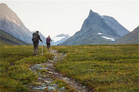 simsearch:6102-07844212,k - A man and a woman hiking Stock Photo - Premium Royalty-Free, Code: 6102-08520566