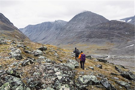 simsearch:6102-07844212,k - A man and a woman hiking Stock Photo - Premium Royalty-Free, Code: 6102-08520571