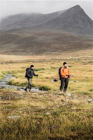 simsearch:6102-07844212,k - A man and a woman hiking Stock Photo - Premium Royalty-Free, Code: 6102-08520572