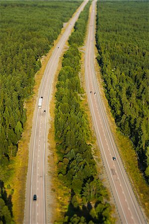 simsearch:6102-06026084,k - Aerial view of country road through forest Stock Photo - Premium Royalty-Free, Code: 6102-08520638