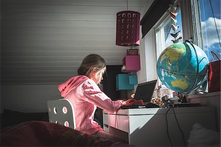 Girl doing homework Stock Photo - Premium Royalty-Free, Code: 6102-08683348