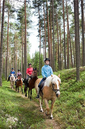 simsearch:6102-08542382,k - Horseback riding through forest Stock Photo - Premium Royalty-Free, Code: 6102-08746650