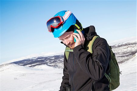 simsearch:6102-07158155,k - Skier talking via cell phone Stock Photo - Premium Royalty-Free, Code: 6102-08746875
