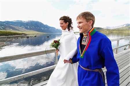 Newlywed couple on jetty Stock Photo - Premium Royalty-Free, Code: 6102-08760402