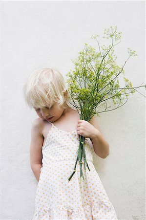 Girl holding fennel bouquet Stock Photo - Premium Royalty-Free, Code: 6102-08760655