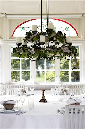 sweden window lamp - Table set in conservatory Stock Photo - Premium Royalty-Free, Code: 6102-08760751