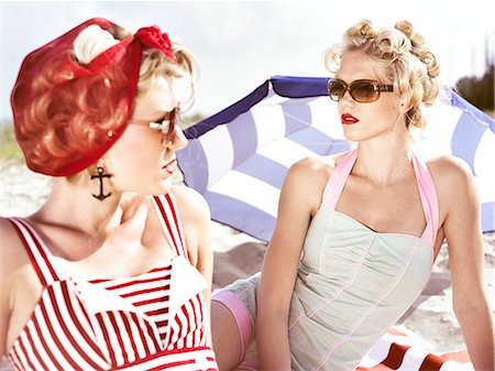 Two retro young women on beach Stock Photo - Premium Royalty-Free, Code: 6102-08760891