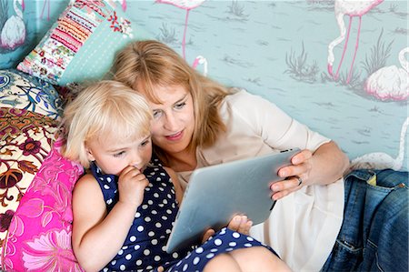 simsearch:6102-08566788,k - Mother with daughter using digital tablet Stock Photo - Premium Royalty-Free, Code: 6102-08760826
