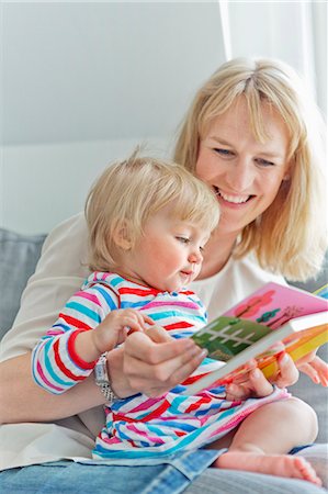 simsearch:6102-08566788,k - Mother with daughter reading book Stock Photo - Premium Royalty-Free, Code: 6102-08760828