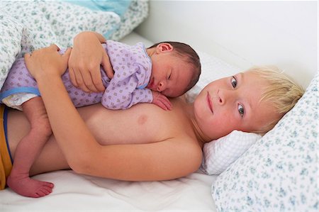 Boy with newborn baby Stock Photo - Premium Royalty-Free, Code: 6102-08761251
