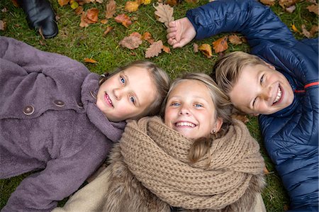 sweden blond boy - Smiling siblings lying on grass, Karlskrona, Blekinge, Sweden Stock Photo - Premium Royalty-Free, Code: 6102-08761386