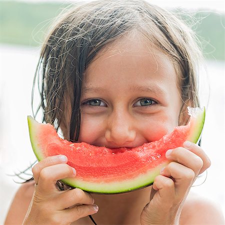 Portrait of girl eating watermelon Stock Photo - Premium Royalty-Free, Code: 6102-08881511