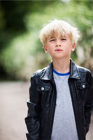 Portrait of boy looking at camera Stock Photo - Premium Royalty-Free, Code: 6102-08881862