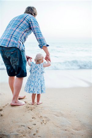 father daughter feet - Father with daughter on beach Stock Photo - Premium Royalty-Free, Code: 6102-08885471