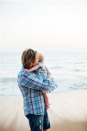 Father with daughter on beach Stock Photo - Premium Royalty-Free, Code: 6102-08885472