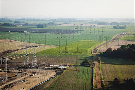 simsearch:6102-06026084,k - Aerial view of electricity pylons on fields Stock Photo - Premium Royalty-Free, Code: 6102-08885421