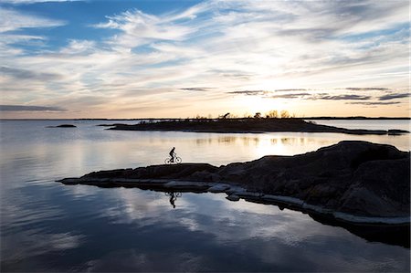 silhouette bike - Person cycling at sea Stock Photo - Premium Royalty-Free, Code: 6102-08885692