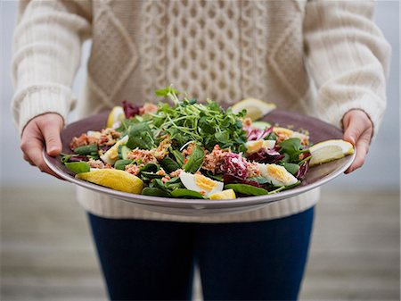 Woman with a plate of salad with crab, Sweden. Stock Photo - Premium Royalty-Free, Code: 6102-08800589