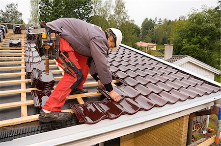 simsearch:6102-07158067,k - A young man roofing, Sweden. Stock Photo - Premium Royalty-Free, Code: 6102-08800617