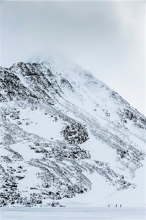 simsearch:6102-07158155,k - Three people skiing on frozen lake Stock Photo - Premium Royalty-Free, Code: 6102-08942644