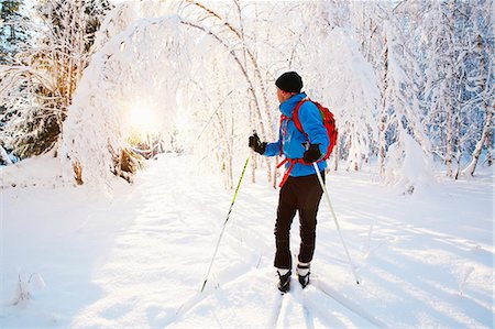 simsearch:6102-07158155,k - Man skiing in scenics forest Stock Photo - Premium Royalty-Free, Code: 6102-08942632