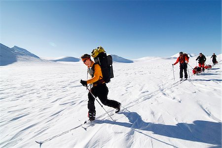 simsearch:6102-08542382,k - Tourists cross country skiing in mountain scenery Stock Photo - Premium Royalty-Free, Code: 6102-08951312