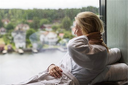 robe - Woman looking through window Stock Photo - Premium Royalty-Free, Code: 6102-08951510