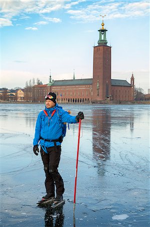 simsearch:6102-08520961,k - Skater on sea, Stockholm City Hall on background, Sweden Stock Photo - Premium Royalty-Free, Code: 6102-08951710
