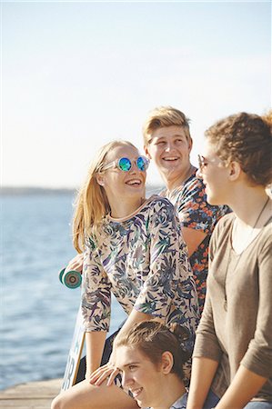 simsearch:6102-08542382,k - Happy friends at sea Stock Photo - Premium Royalty-Free, Code: 6102-08951808