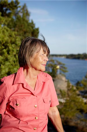 Senior woman looking away Stock Photo - Premium Royalty-Free, Code: 6102-08994647