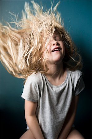 Girl tossing hair Stock Photo - Premium Royalty-Free, Code: 6102-08995773