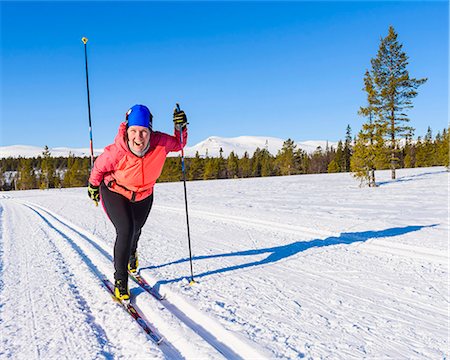 simsearch:6102-07158155,k - Happy woman cross-country skiing Stock Photo - Premium Royalty-Free, Code: 6102-08996569