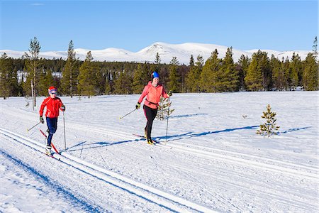 simsearch:6102-07158155,k - Mother and son cross-country skiing Stock Photo - Premium Royalty-Free, Code: 6102-08996571