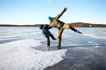 simsearch:6102-08520961,k - Father with son ice-skating on frozen lake Stock Photo - Premium Royalty-Free, Code: 6102-08996632