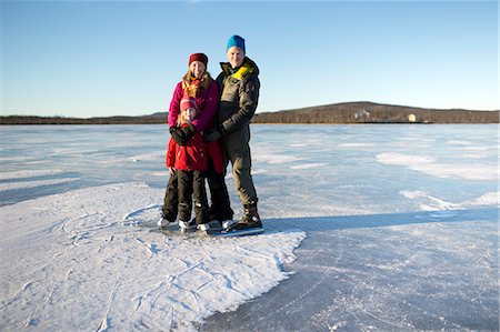 simsearch:6102-08520961,k - Parents with daughter skating on frozen lake Stock Photo - Premium Royalty-Free, Code: 6102-08996639