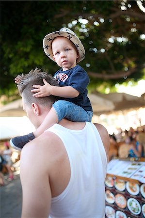 Father carrying son on shoulders Stock Photo - Premium Royalty-Free, Code: 6102-08996796