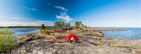 Man by tent at coast Stock Photo - Premium Royalty-Free, Code: 6102-08996815